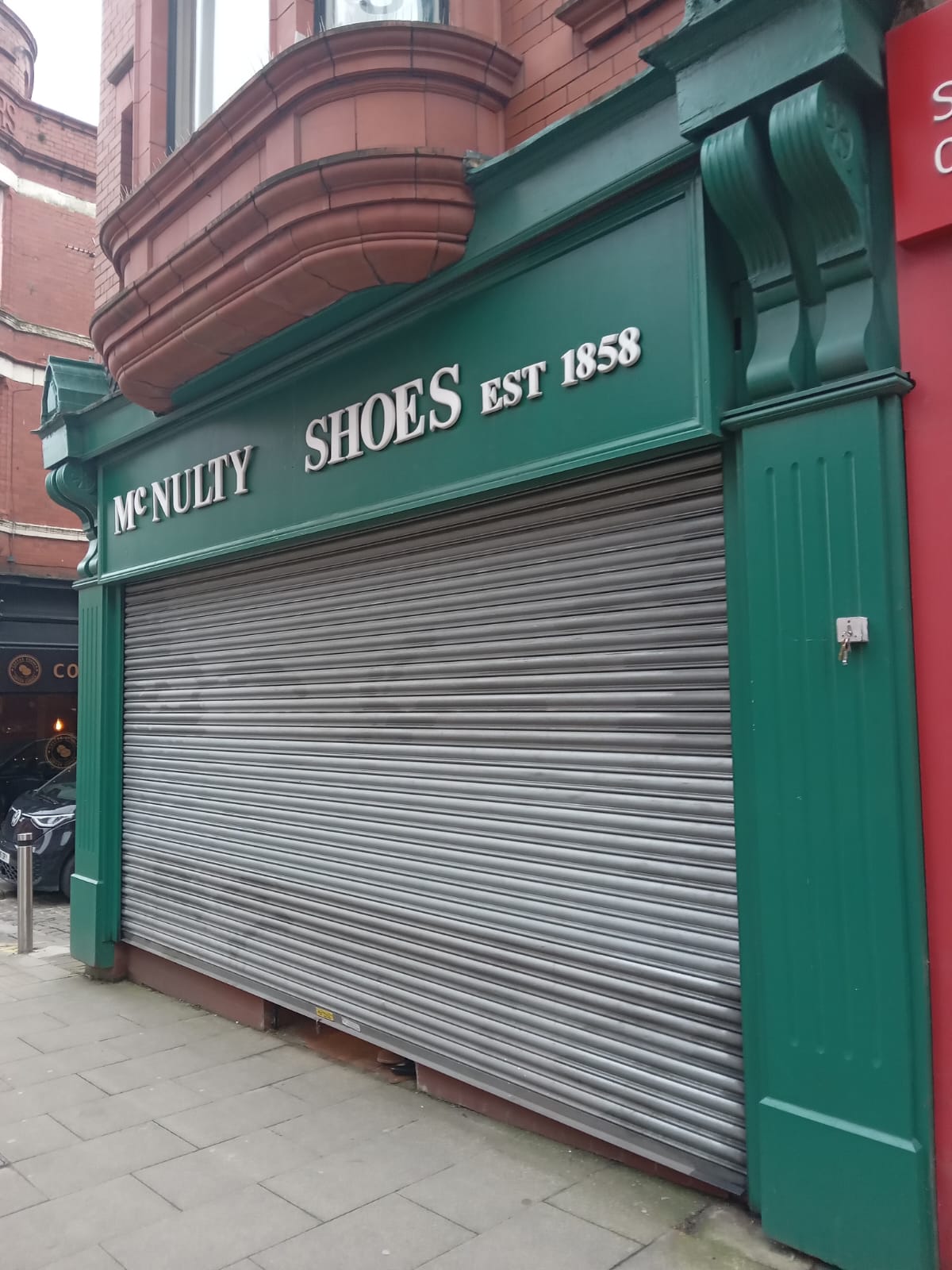 roller shutter repair to McNultys Crewe by UK Doors & Shutters