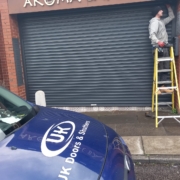 roller shutter being fixed by UK Doors & Shutters