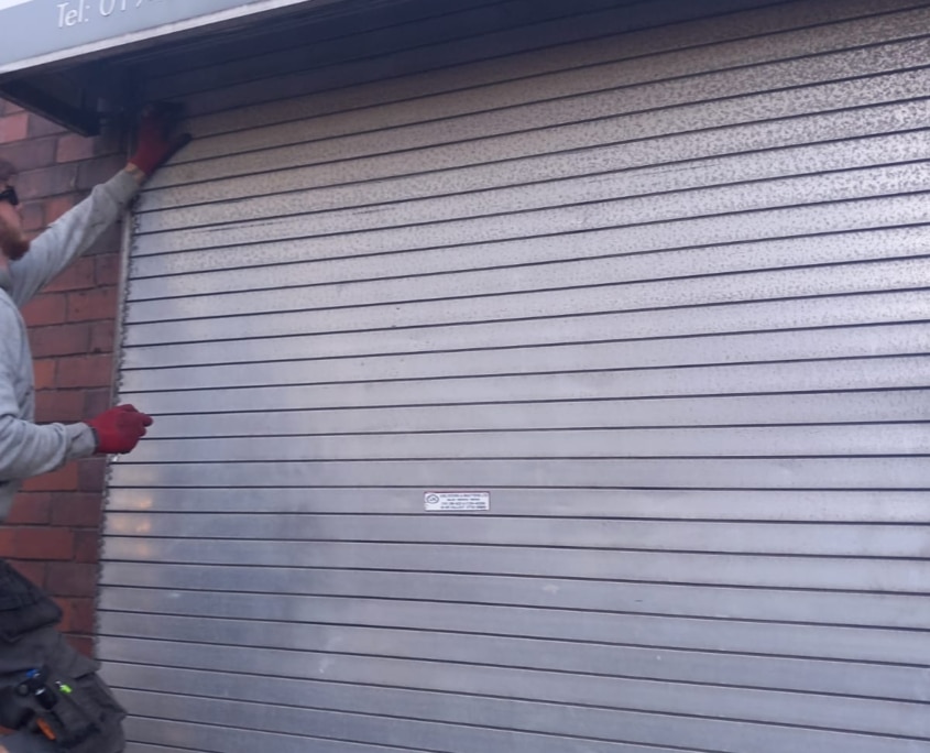 large shop roller shutter repaired in Runcorn by UK Doors & Shutters